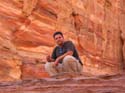 David near a red wall in Petra